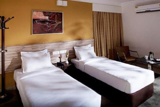 Hotel Metro Park Inn Kójamputtúr Pokoj fotografie
